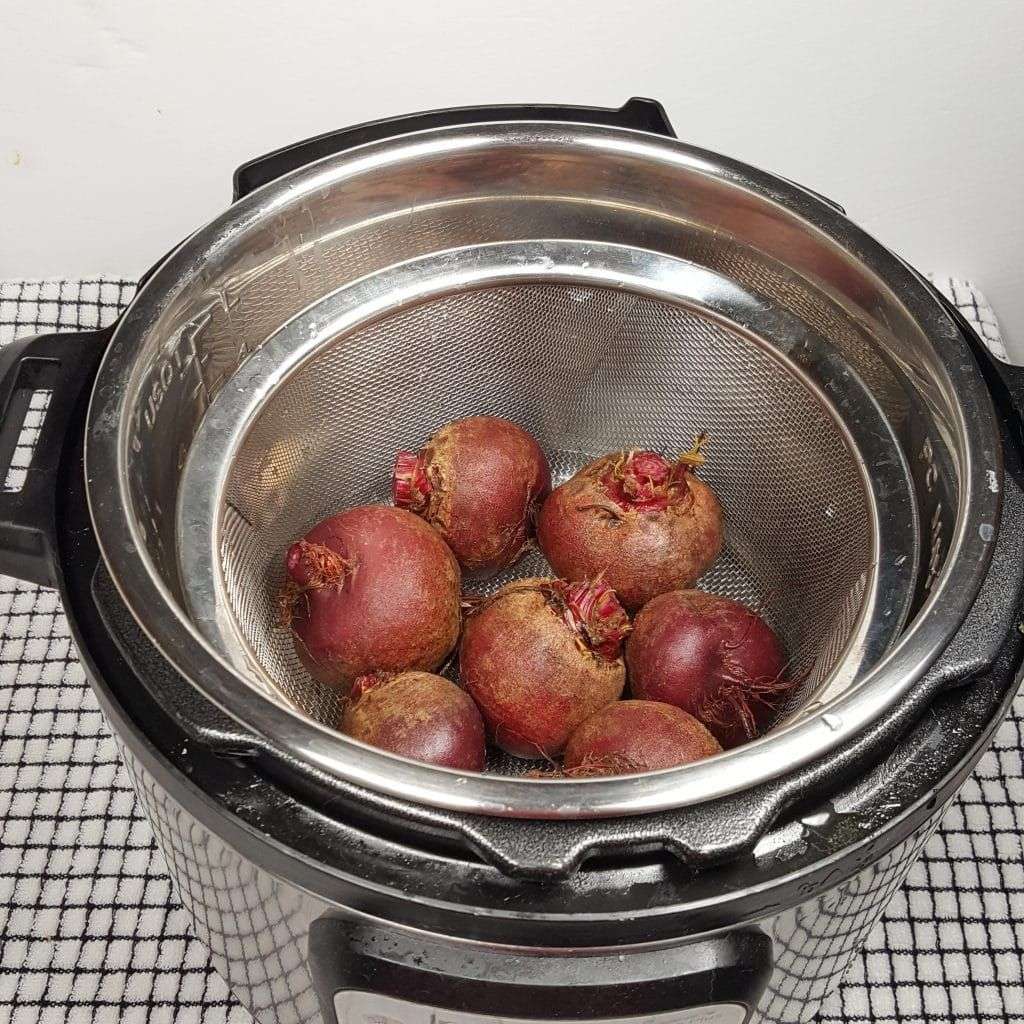 Add Water and the Beets to Pressure Cooker Image