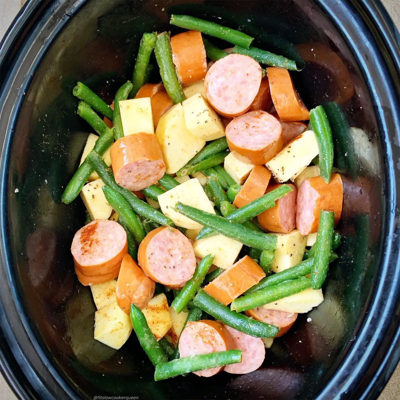 Sausage, potatoes, and green beans cook together in this simple slow ...